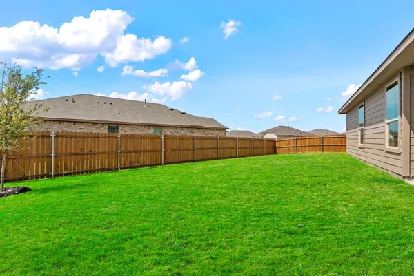 a view of a backyard with garden