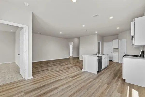a view of kitchen with wooden floor