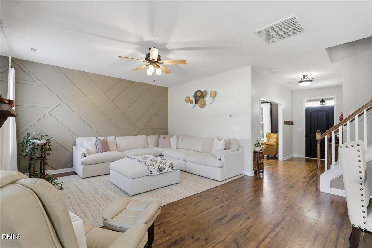 136 Fallingbrook Drive Kenly, NC 27542 - Photo 9 of 54 a living room with furniture flowerpot and a chandelier