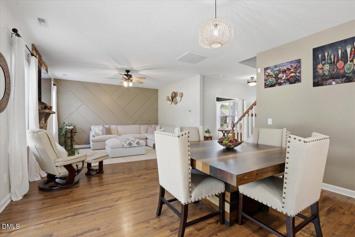 136 Fallingbrook Drive Kenly, NC 27542 - Photo 12 of 54 a living room with furniture and a chandelier