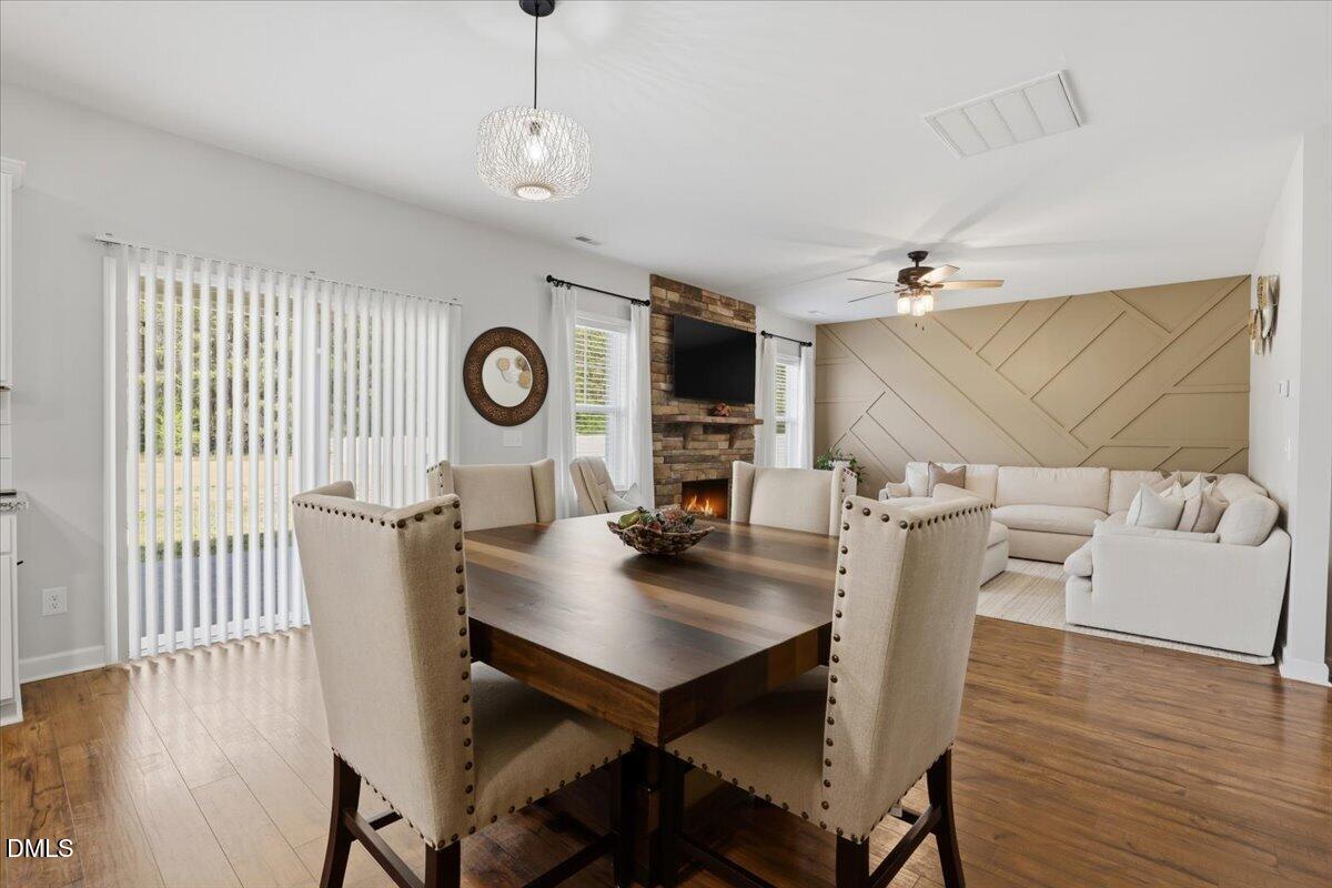 136 Fallingbrook Drive Kenly, NC 27542 - Photo 14 of 54 a view of a dining room with furniture and wooden floor