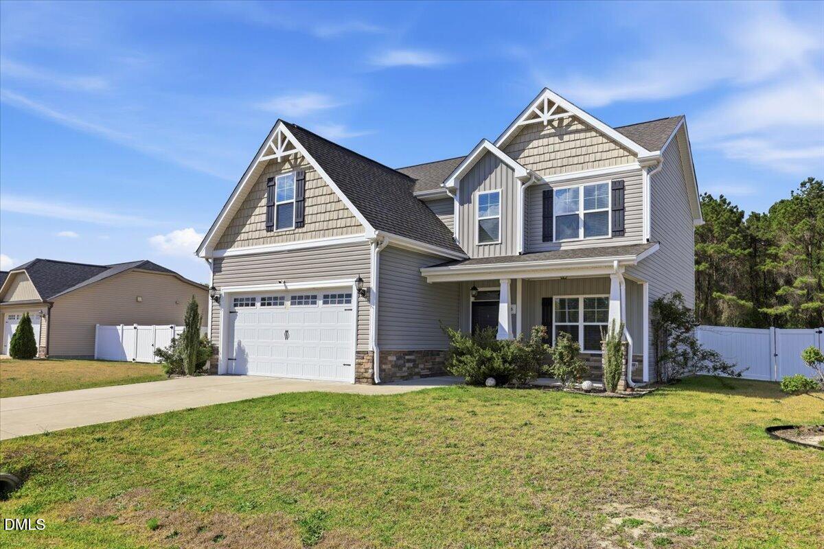 136 Fallingbrook Drive Kenly, NC 27542 - Photo 2 of 54 a view of a yard in front of a house