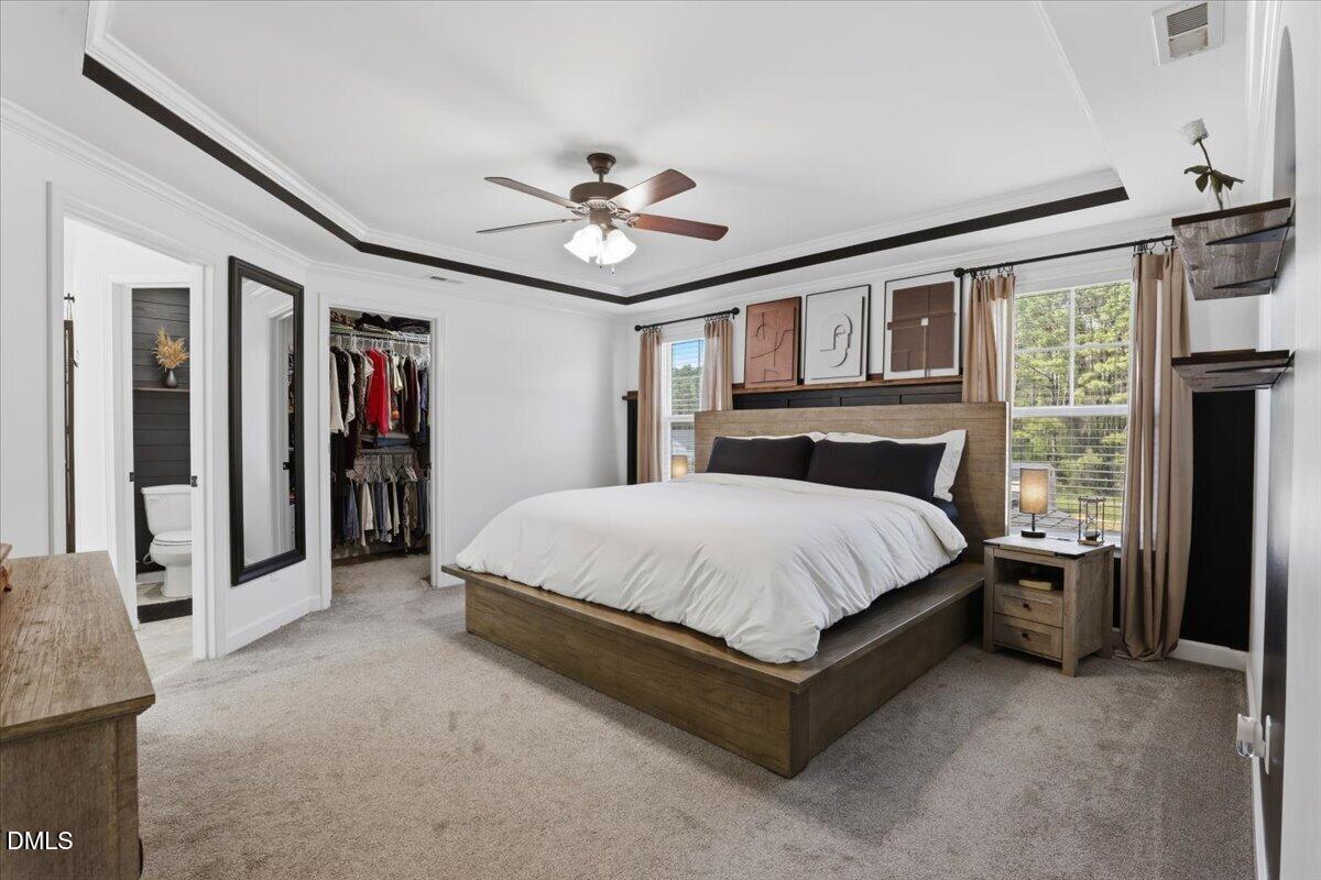 136 Fallingbrook Drive Kenly, NC 27542 - Photo 28 of 54 a bed sitting in a spacious bedroom next to a window
