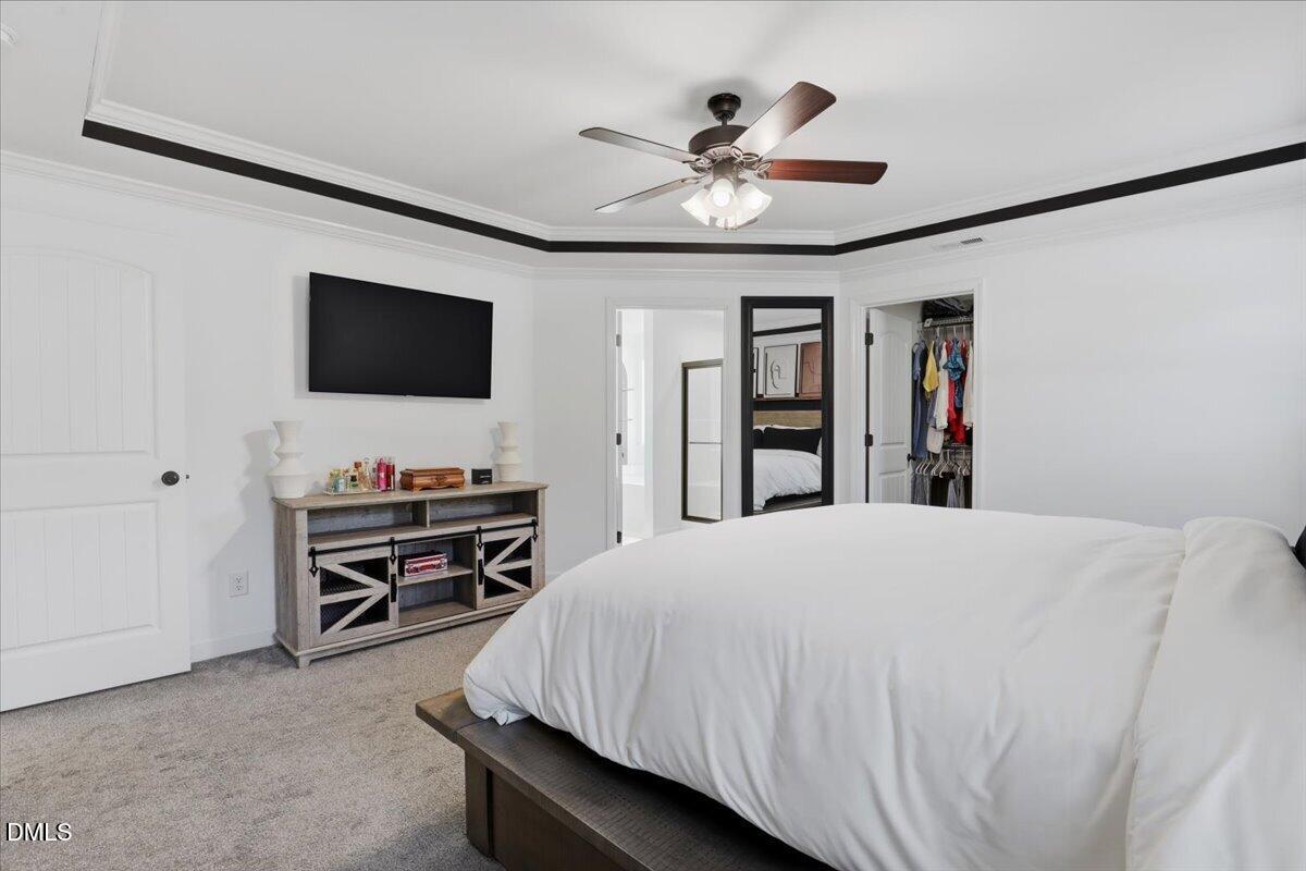 136 Fallingbrook Drive Kenly, NC 27542 - Photo 29 of 54 a bedroom with a bed and a flat screen tv