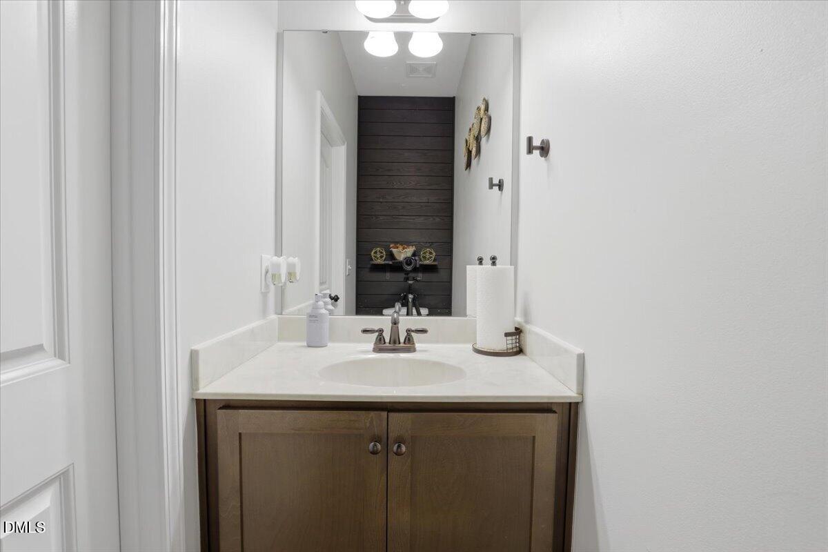 136 Fallingbrook Drive Kenly, NC 27542 - Photo 30 of 54 a bathroom with a sink and a mirror