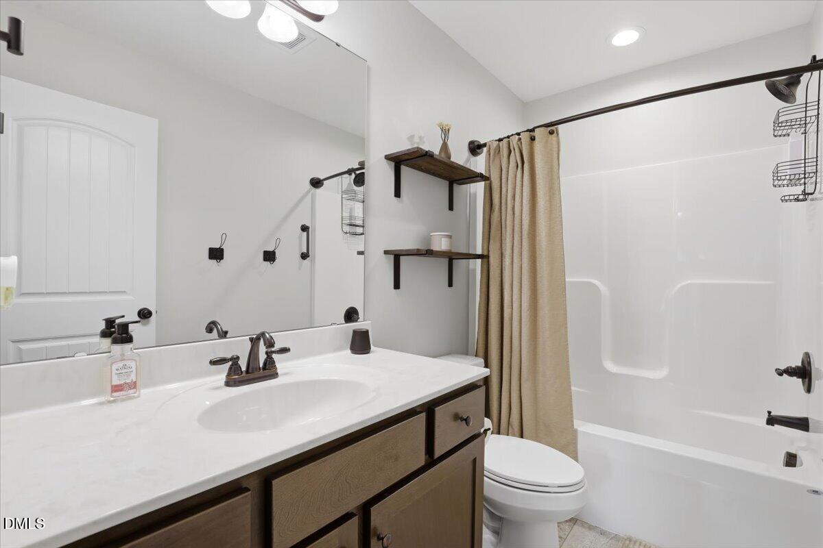 136 Fallingbrook Drive Kenly, NC 27542 - Photo 31 of 54 a bathroom with a sink toilet tub and shower