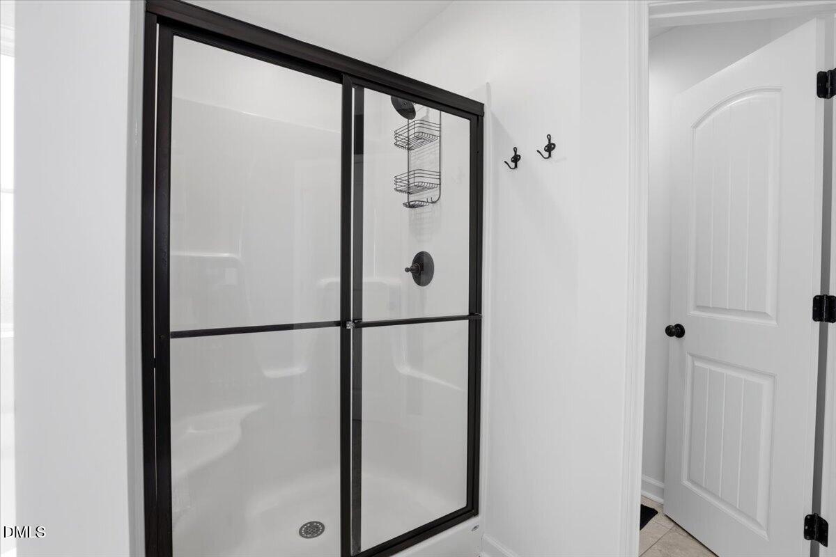 136 Fallingbrook Drive Kenly, NC 27542 - Photo 35 of 54 a white glass door and shower door