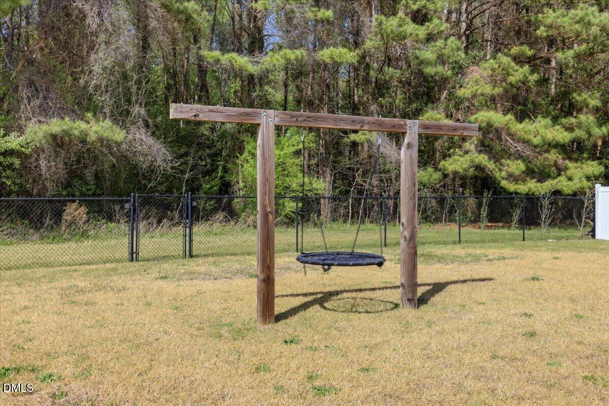 136 Fallingbrook Drive Kenly, NC 27542 - Photo 42 of 54 a view of a yard with a slide