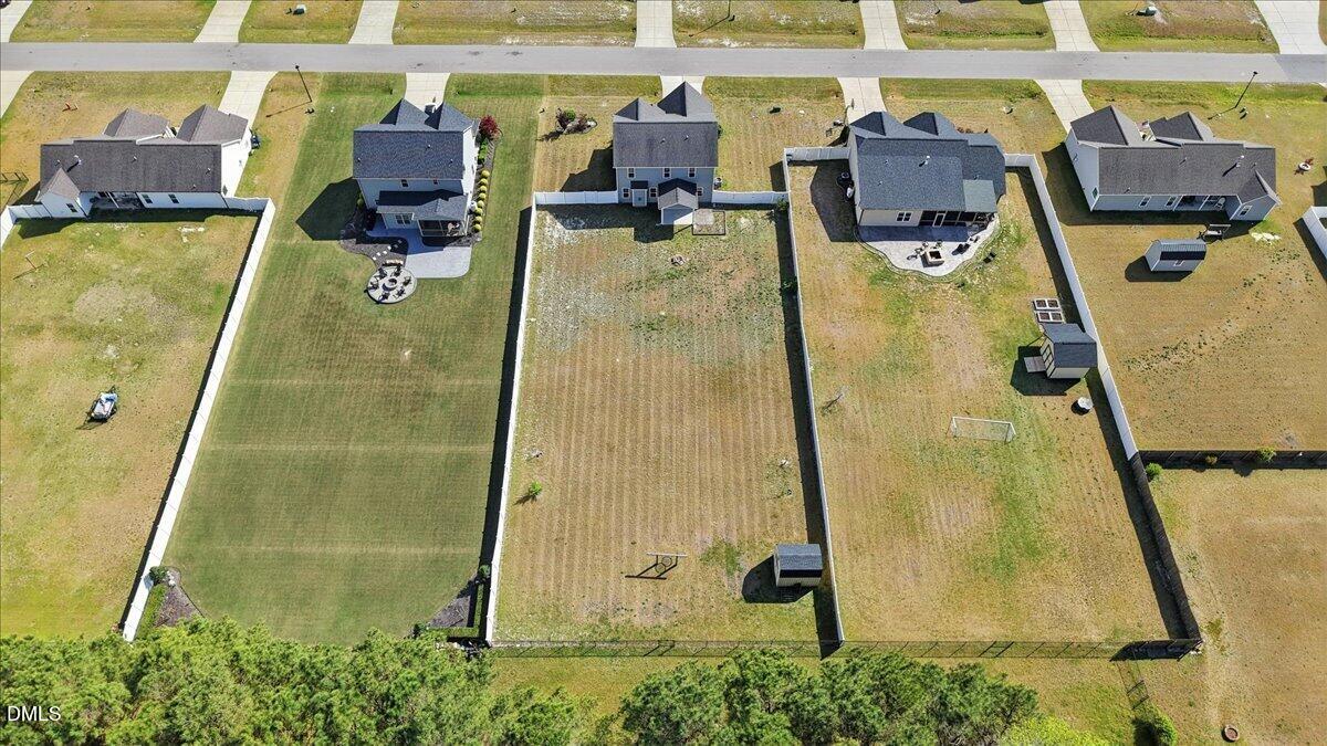 136 Fallingbrook Drive Kenly, NC 27542 - Photo 50 of 54 an aerial view of a pool with seating area