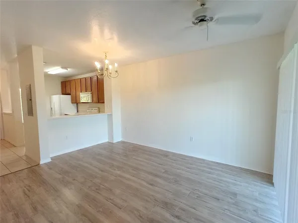 a view of a kitchen from the hallway