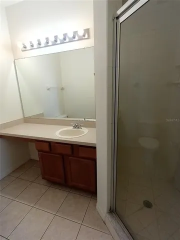 a view of bathroom with a sink and vanity