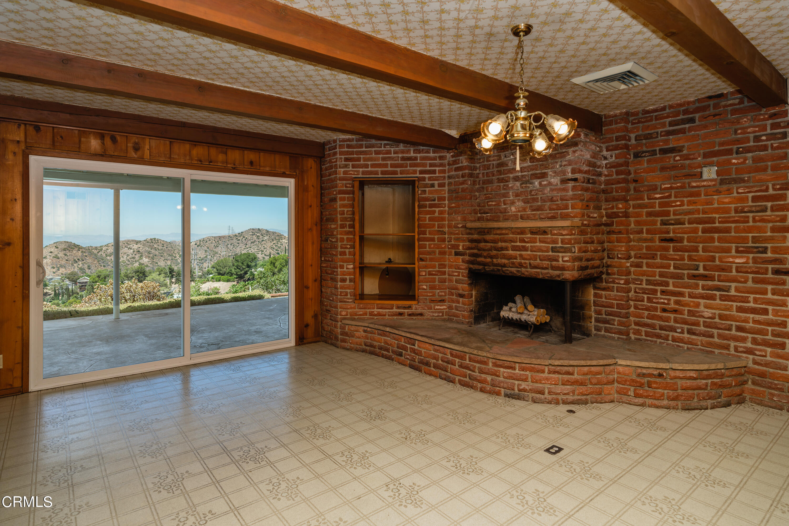 7162 Estepa Drive Tujunga, CA 91042 - Photo 12 of 43 a view of fireplace and window in an empty room