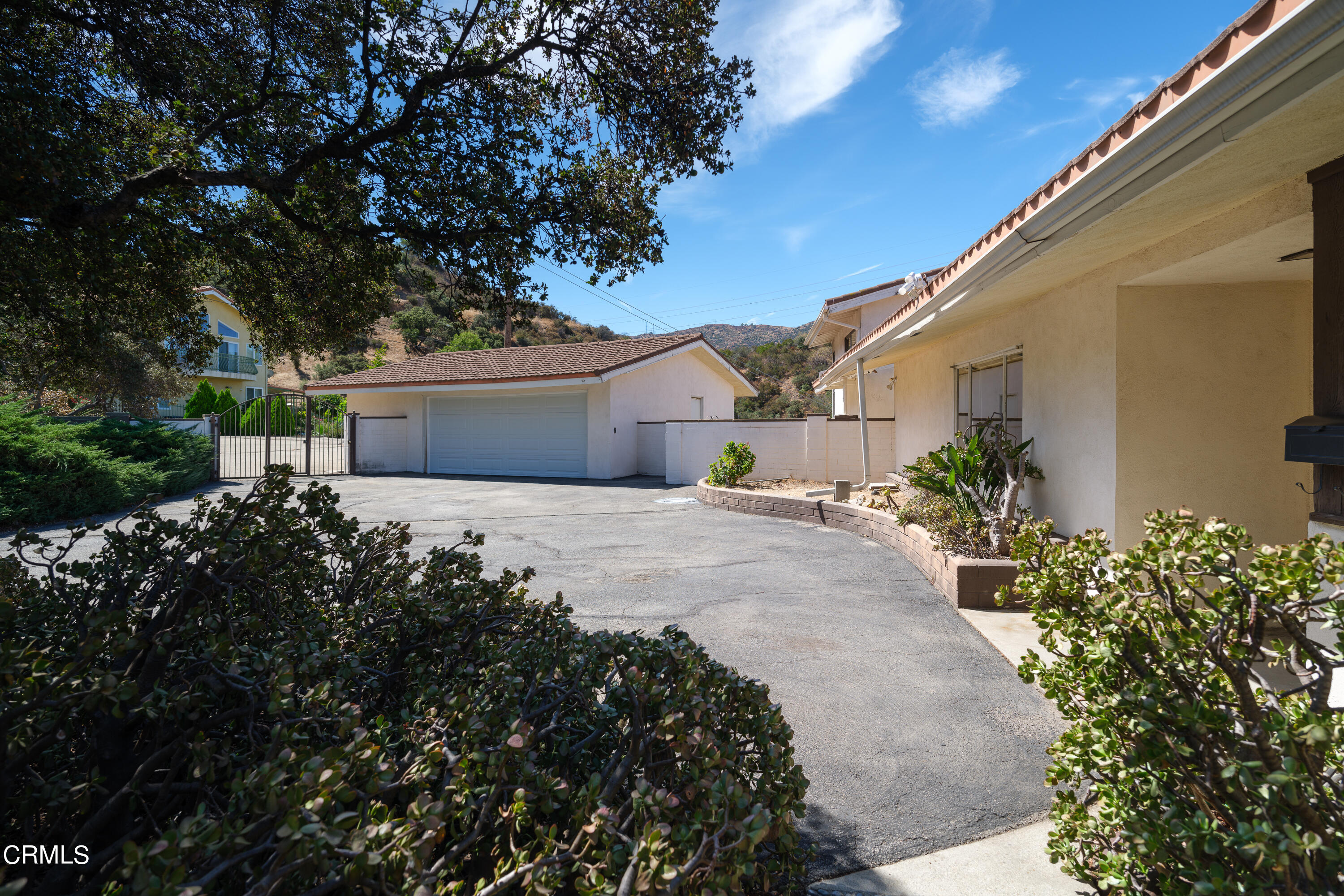 7162 Estepa Drive Tujunga, CA 91042 - Photo 33 of 43 a front view of a house with a garden