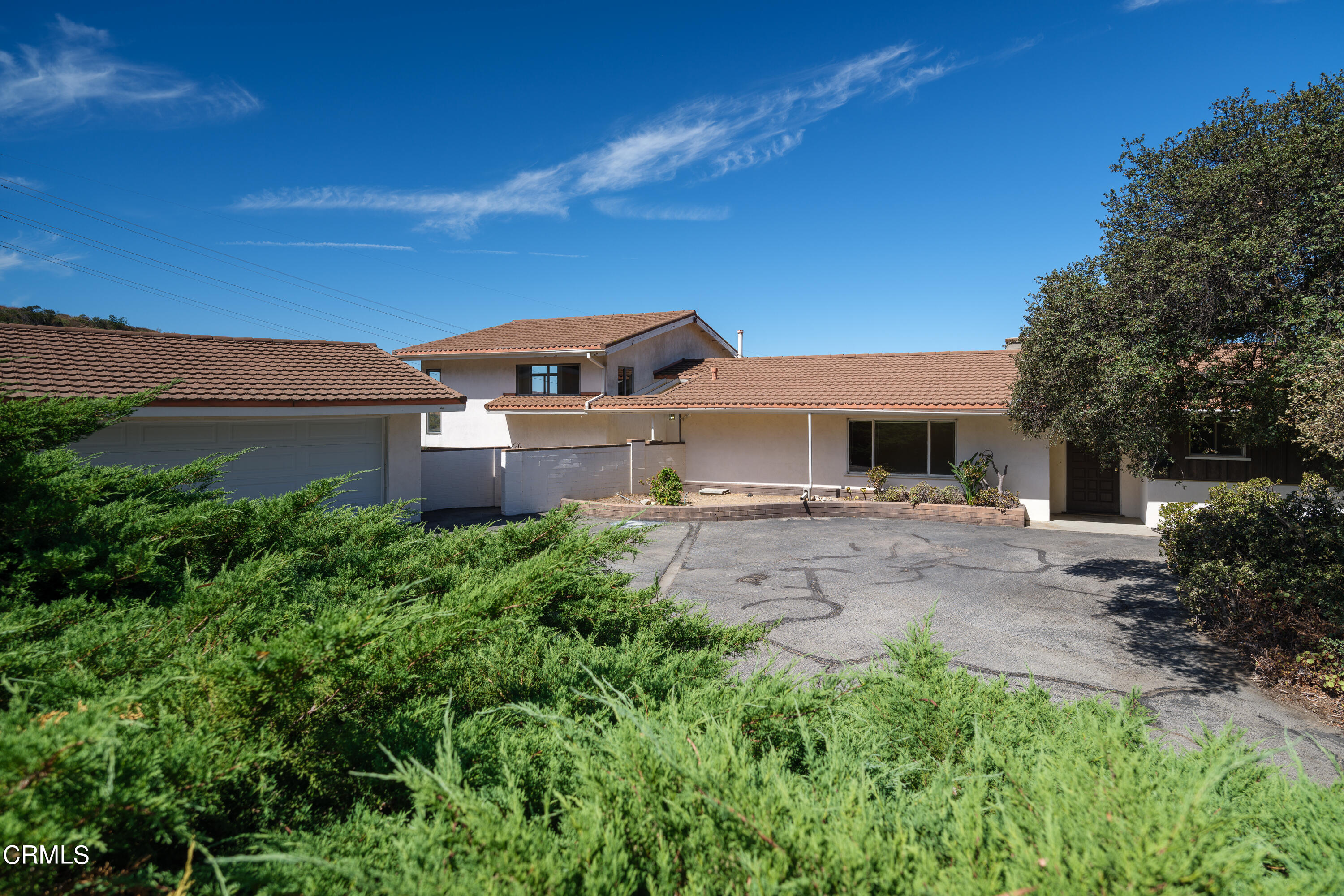 7162 Estepa Drive Tujunga, CA 91042 - Photo 6 of 43 a front view of a house with a garden