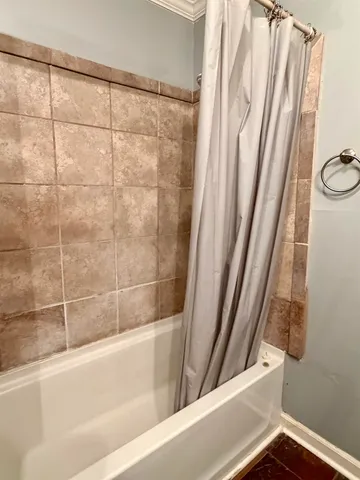 a view of a bathroom with a bathtub
