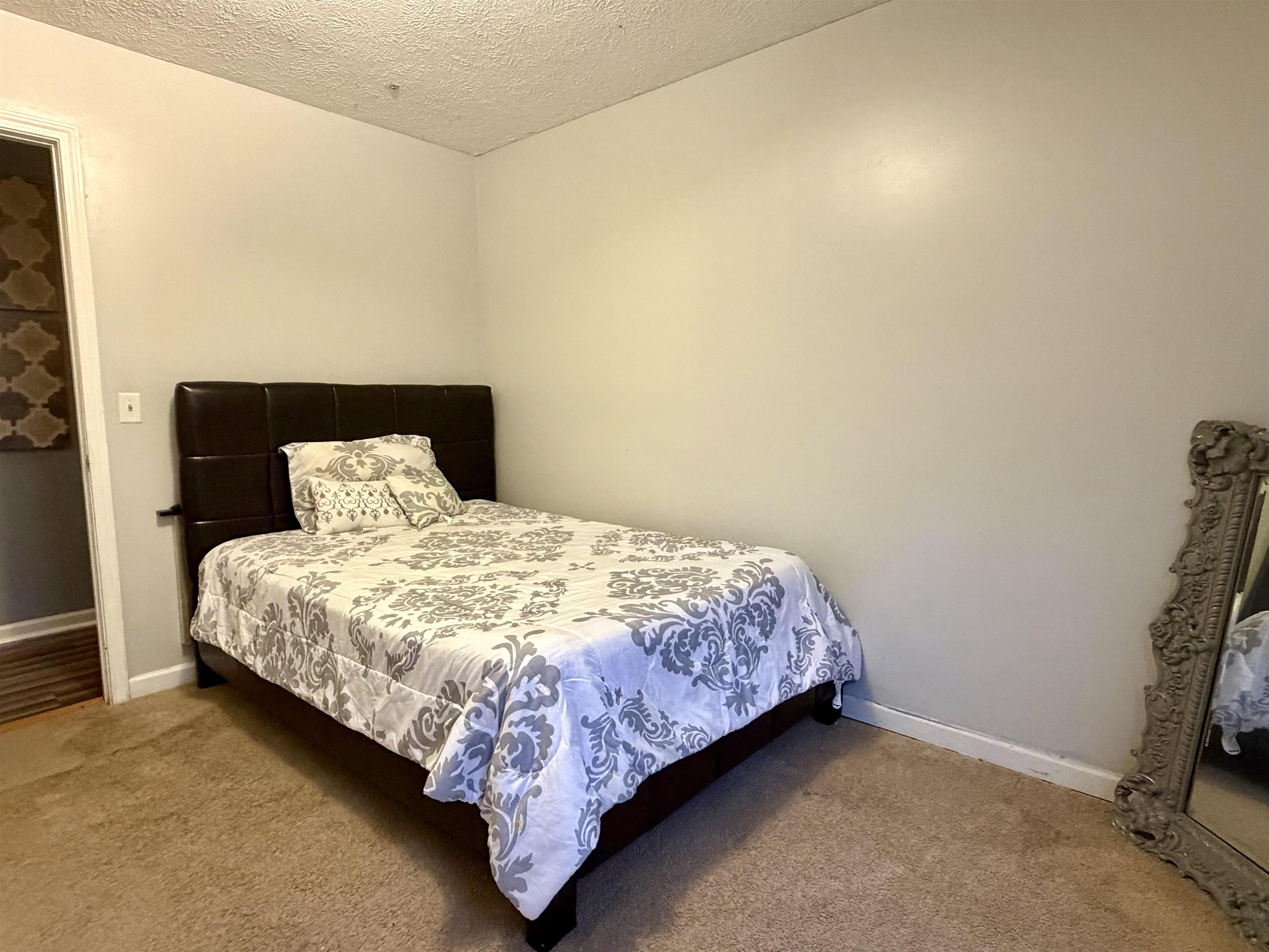 82 Shane Lane Ramer, TN 38367 - Photo 5 of 18 a bedroom with a bed and a window