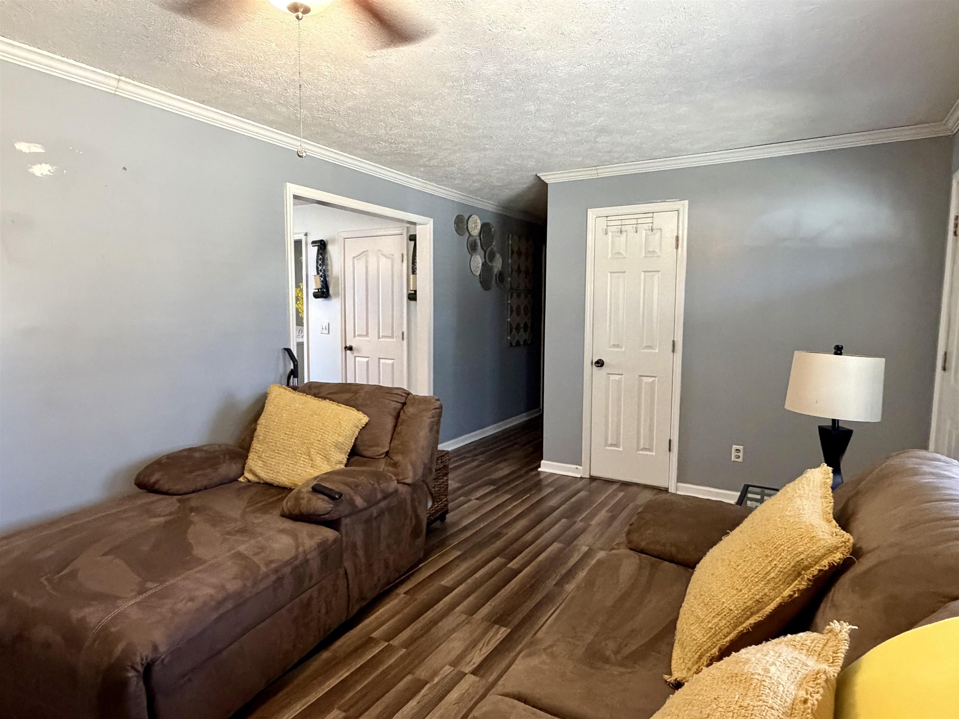 82 Shane Lane Ramer, TN 38367 - Photo 5 of 18 a bedroom with a bed and wooden floor