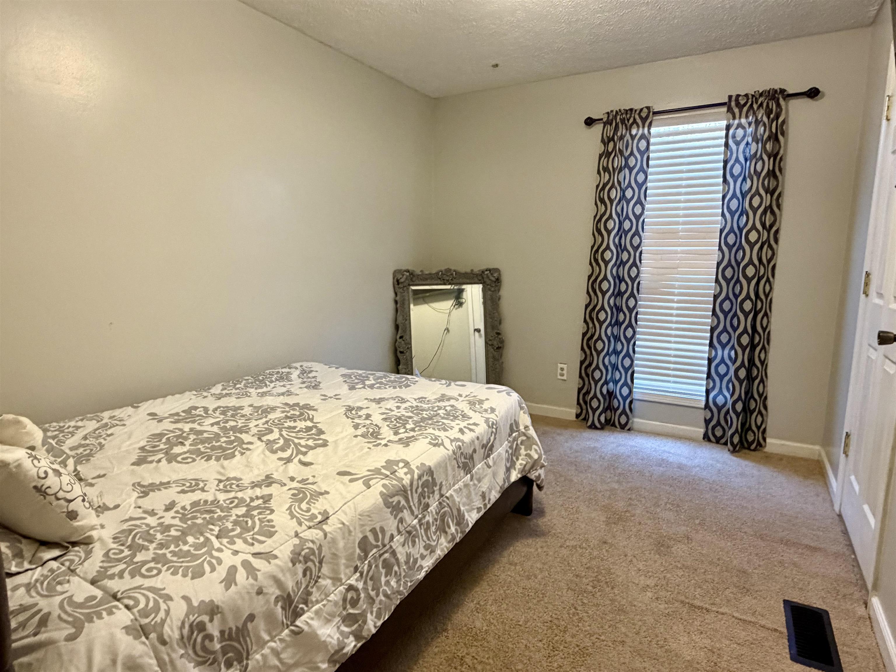 82 Shane Lane Ramer, TN 38367 - Photo 6 of 18 a bedroom with a bed and a window