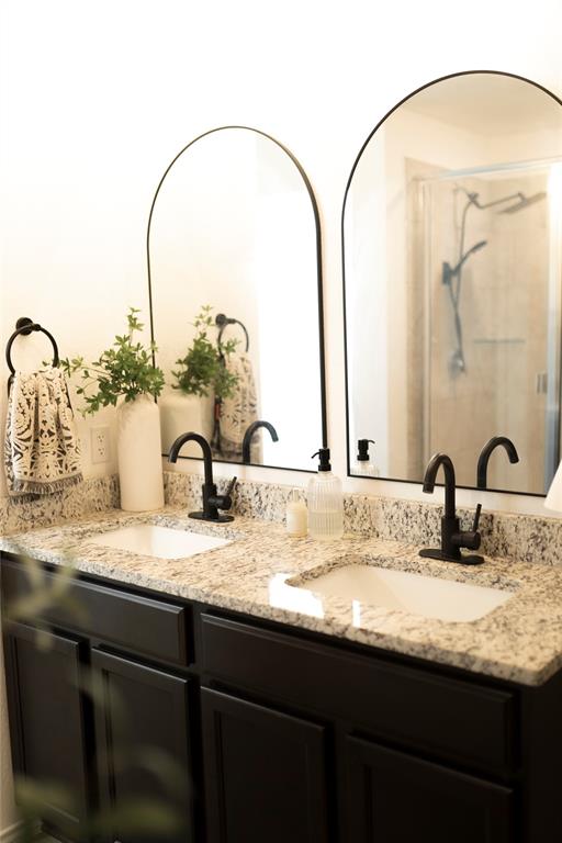 3224 Sherco Road Lorena, TX 76655 - Photo 13 of 20 a bathroom with a granite countertop sink and a mirror