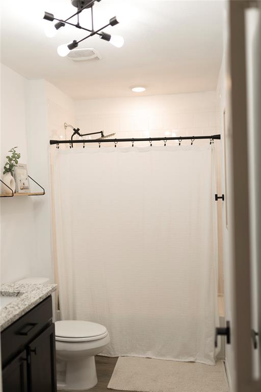 3224 Sherco Road Lorena, TX 76655 - Photo 19 of 20 a bathroom with a granite countertop sink toilet and shower