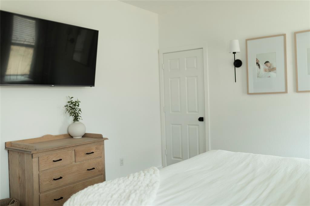 3224 Sherco Road Lorena, TX 76655 - Photo 10 of 20 a bedroom with a bed and a flat screen tv