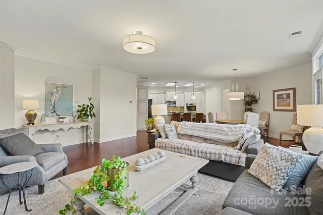 a living room with furniture and a large mirror
