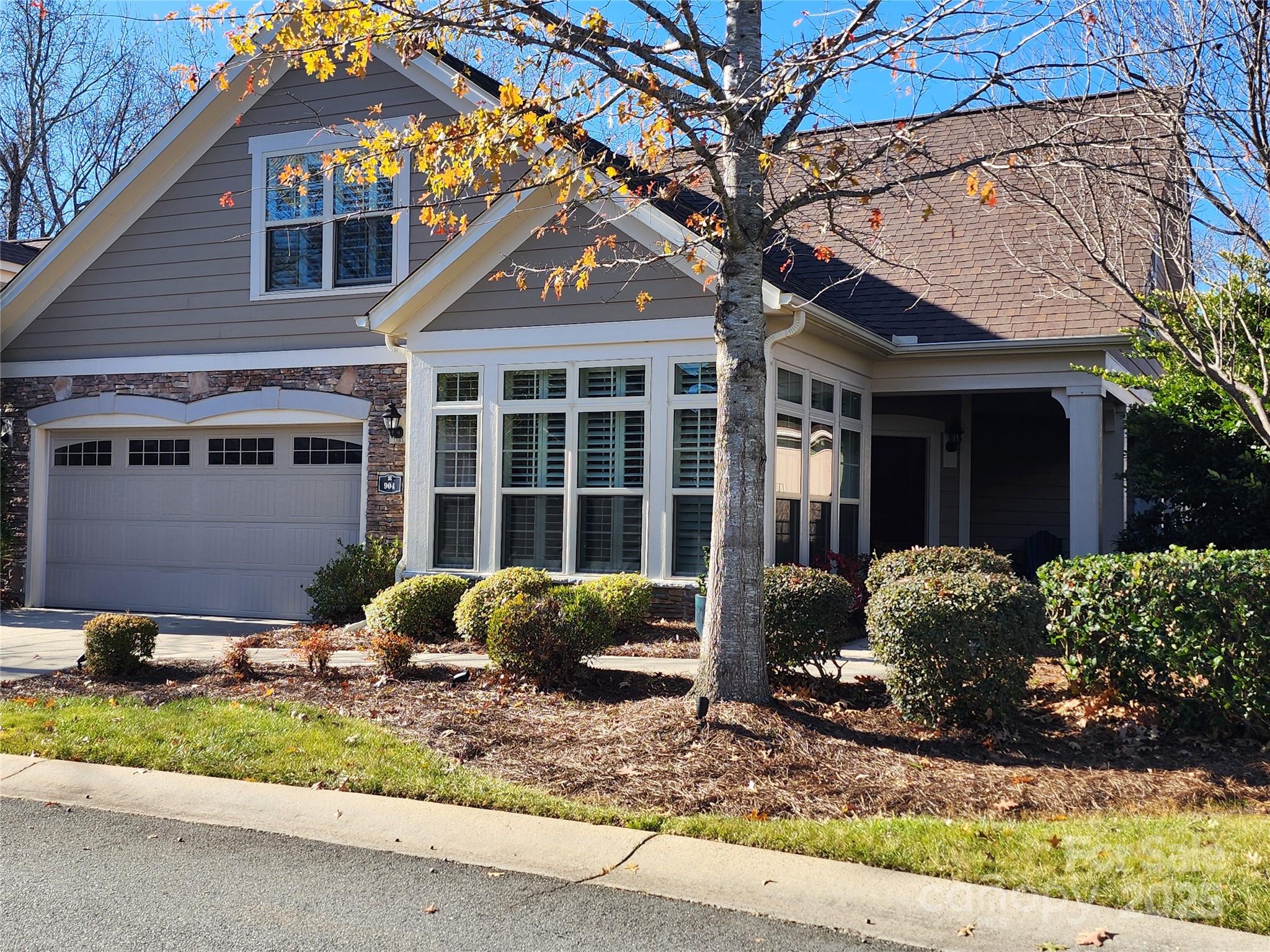 904 Morningstar Lane Matthews, NC 28104 - Photo 2 of 2 a front view of a house with garden and plants