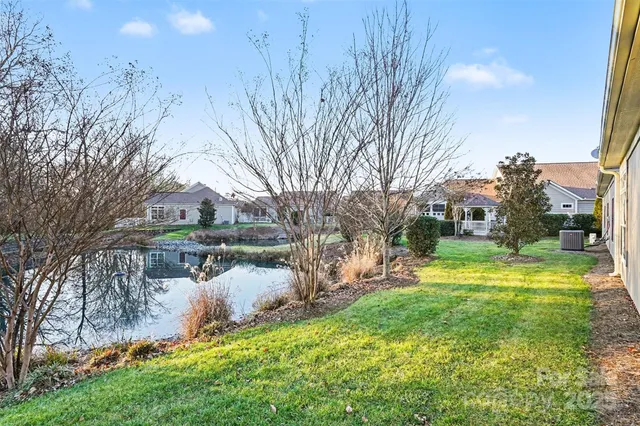 a view of a lake with a house in the background
