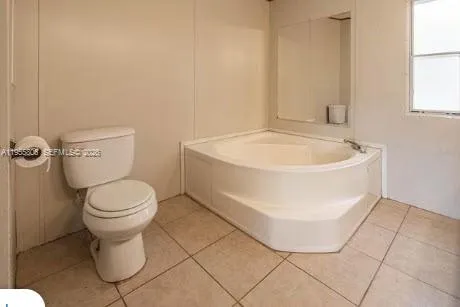 a bathroom with a toilet and a sink