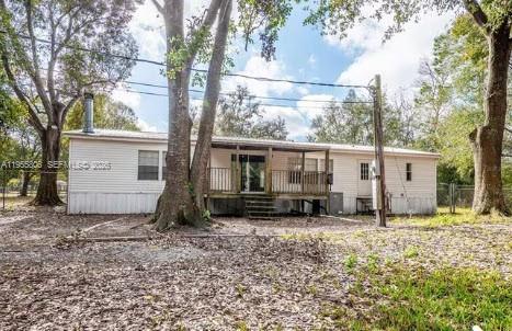 1604 Pineford Road Lakeland, FL 33809 - Photo 24 of 28 a view of a house with backyard and a tree
