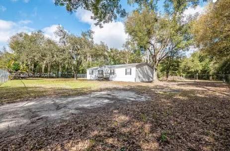1604 Pineford Road Lakeland, FL 33809 - Photo 26 of 28 a view of a house with yard and tree s