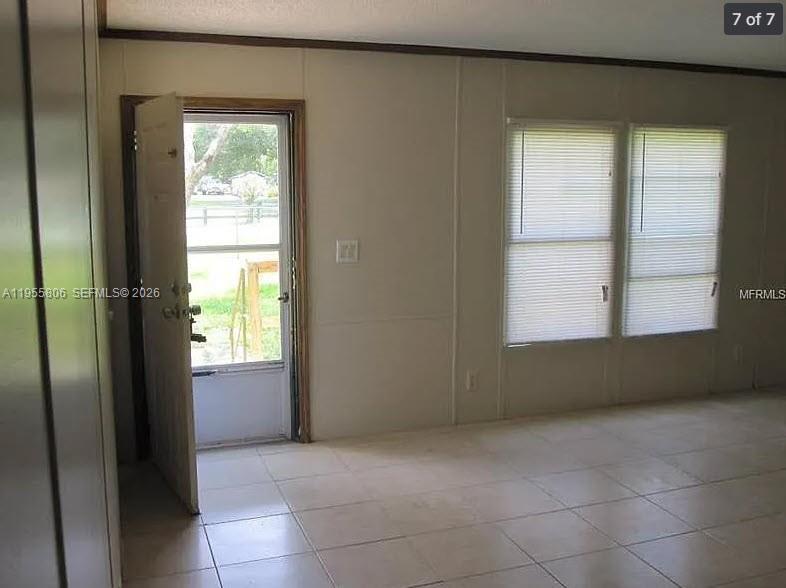 1604 Pineford Road Lakeland, FL 33809 - Photo 3 of 28 a view of an empty room and window