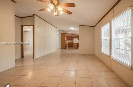 1604 Pineford Road Lakeland, FL 33809 - Photo 4 of 28 a view of a livingroom with a chandelier fan and windows