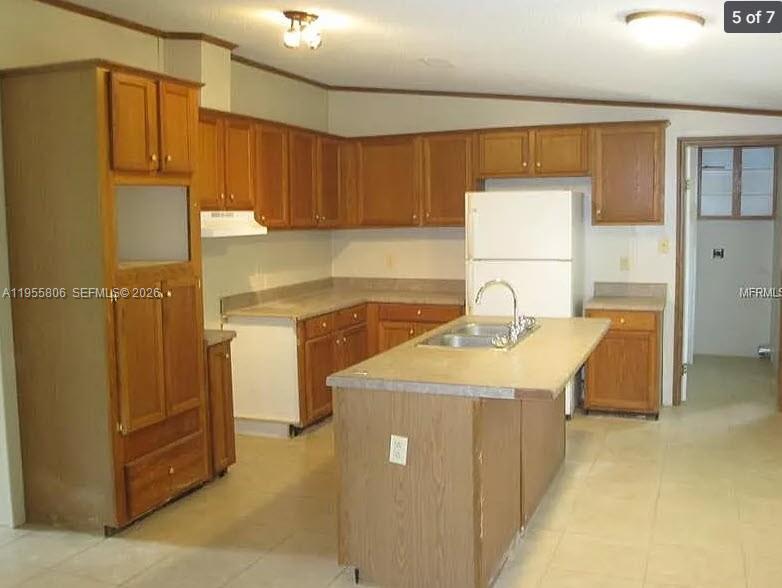 1604 Pineford Road Lakeland, FL 33809 - Photo 9 of 28 a kitchen with a sink cabinets and appliances
