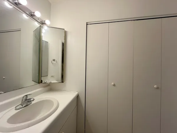 a bathroom with a toilet a sink and bathtub