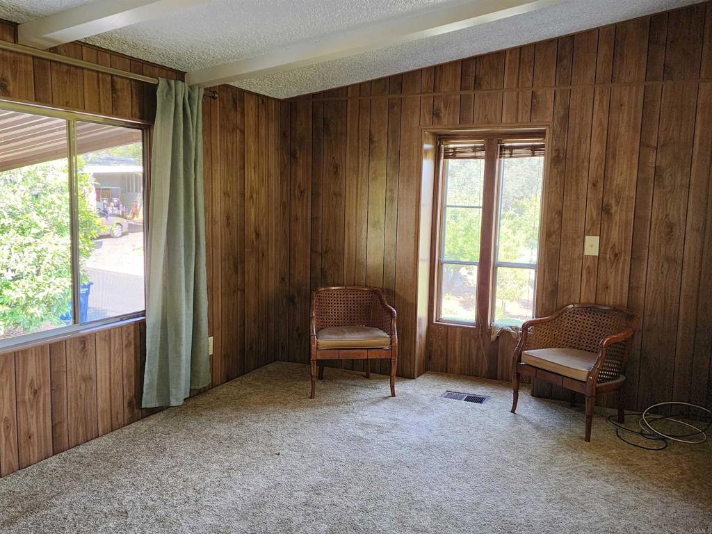 18218 Paradise Mountain Road Valley Center, CA 92082 - Photo 12 of 32 a living room with furniture and a window