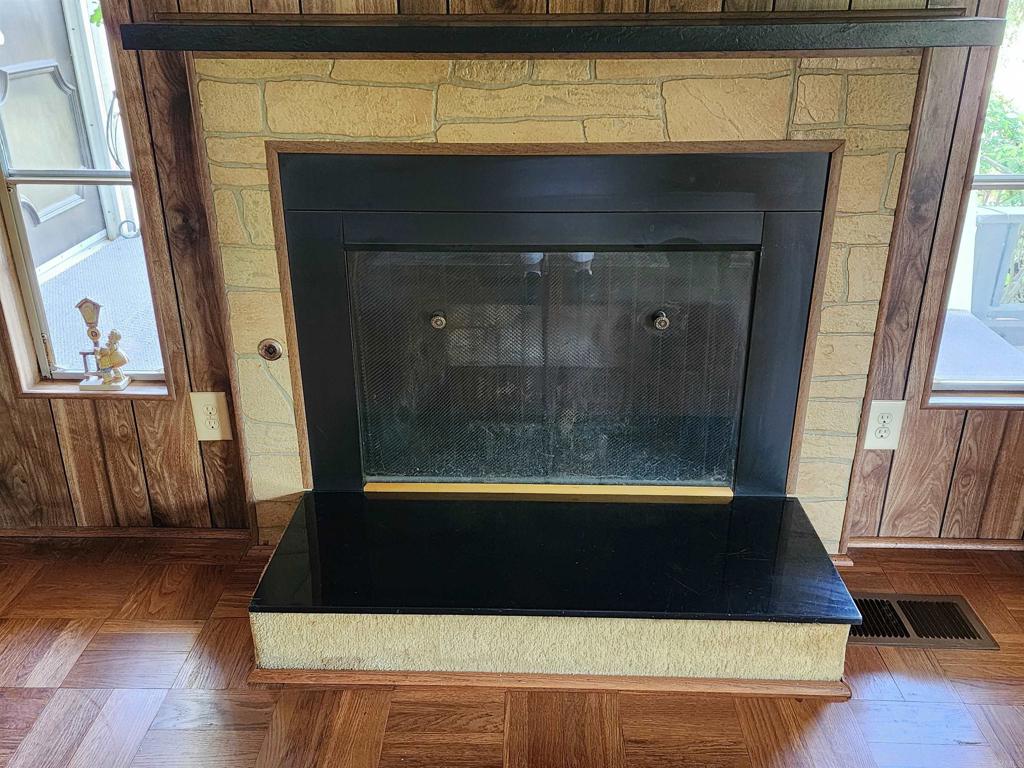 18218 Paradise Mountain Road Valley Center, CA 92082 - Photo 14 of 32 a room with wooden floor and chair