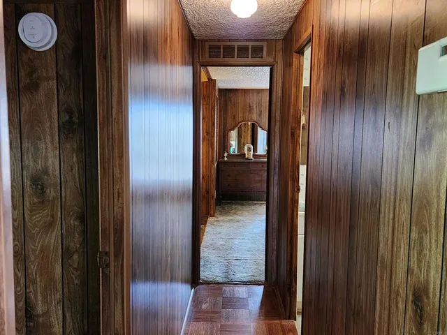 a bedroom with a bed and a mirror