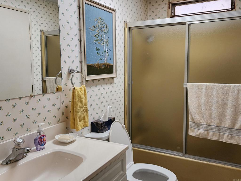 18218 Paradise Mountain Road Valley Center, CA 92082 - Photo 23 of 32 a bathroom with a sink and a mirror