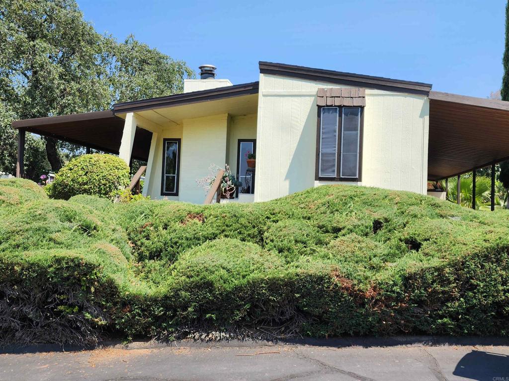 18218 Paradise Mountain Road Valley Center, CA 92082 - Photo 3 of 32 a view of a house with a small yard