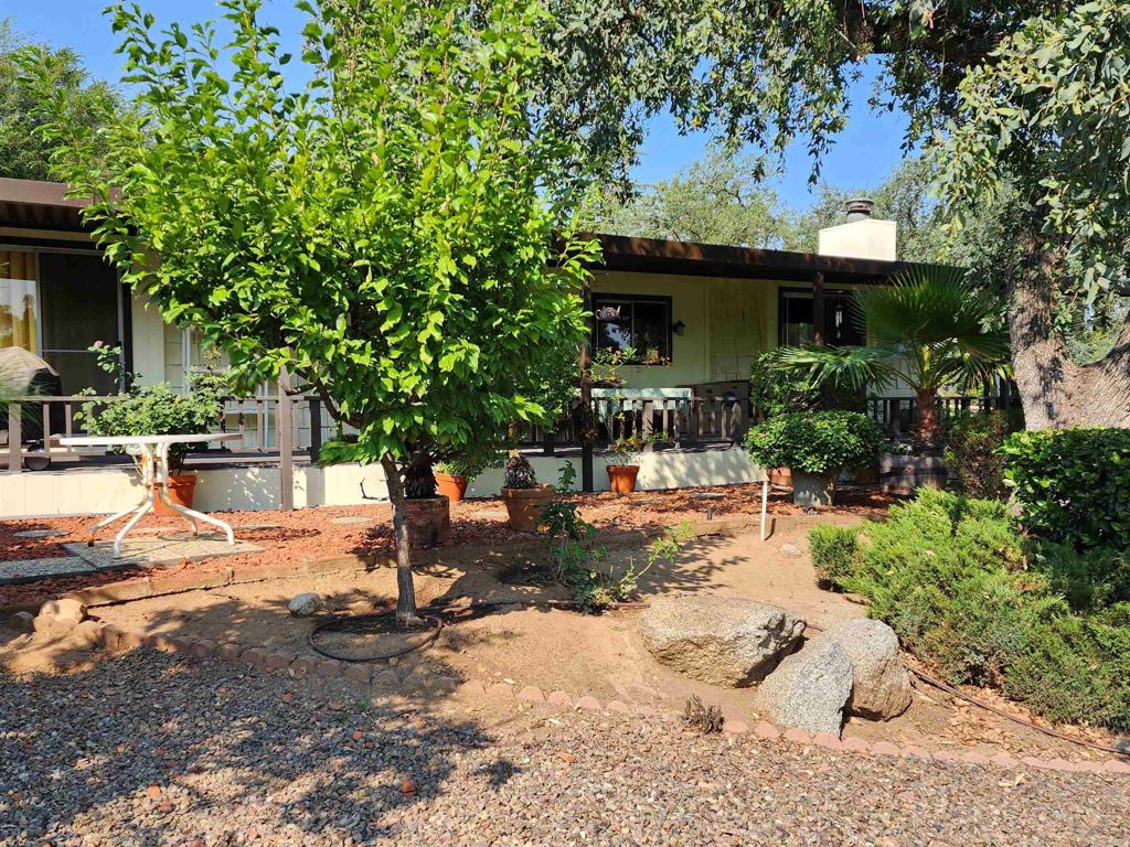 18218 Paradise Mountain Road Valley Center, CA 92082 - Photo 5 of 32 a view of a house with backyard and sitting area