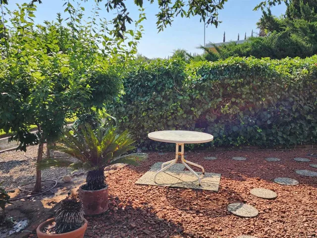 a view of a backyard of a house