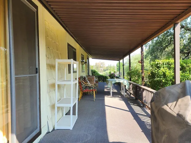 a view of balcony with wooden floor