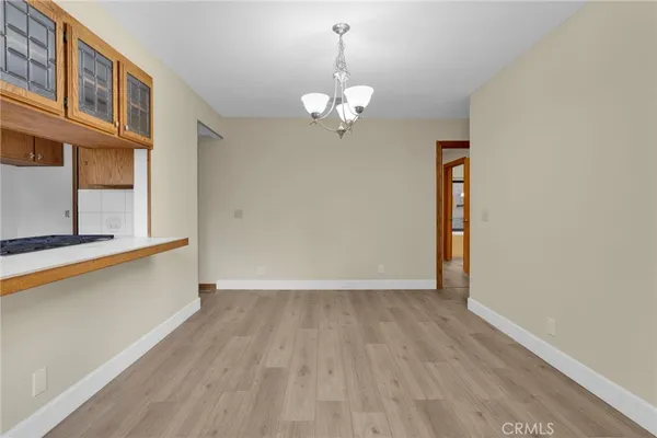 a kitchen with a sink cabinets appliances and a window