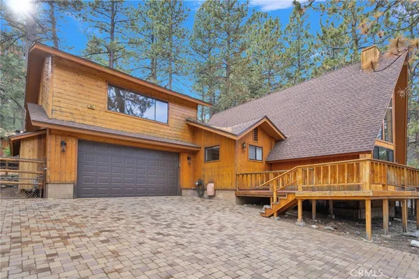 a front view of a house with garage