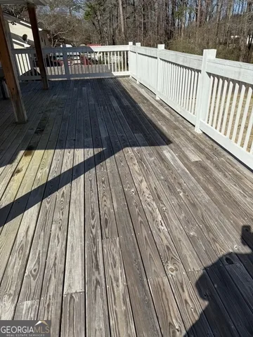 a view of balcony with wooden floor