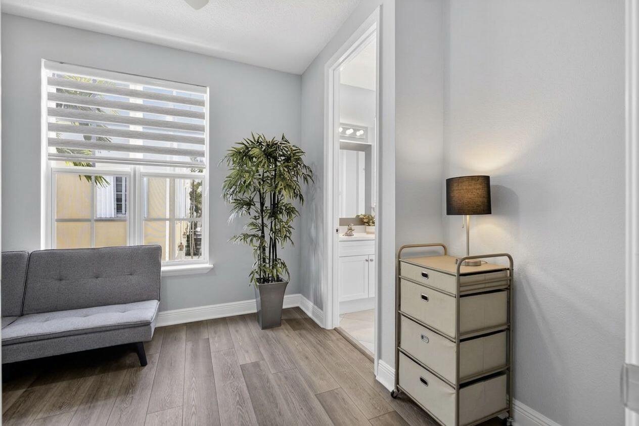 108 Morning Dew Circle Jupiter, FL 33458 - Photo 15 of 46 a living room with furniture and a flat screen tv