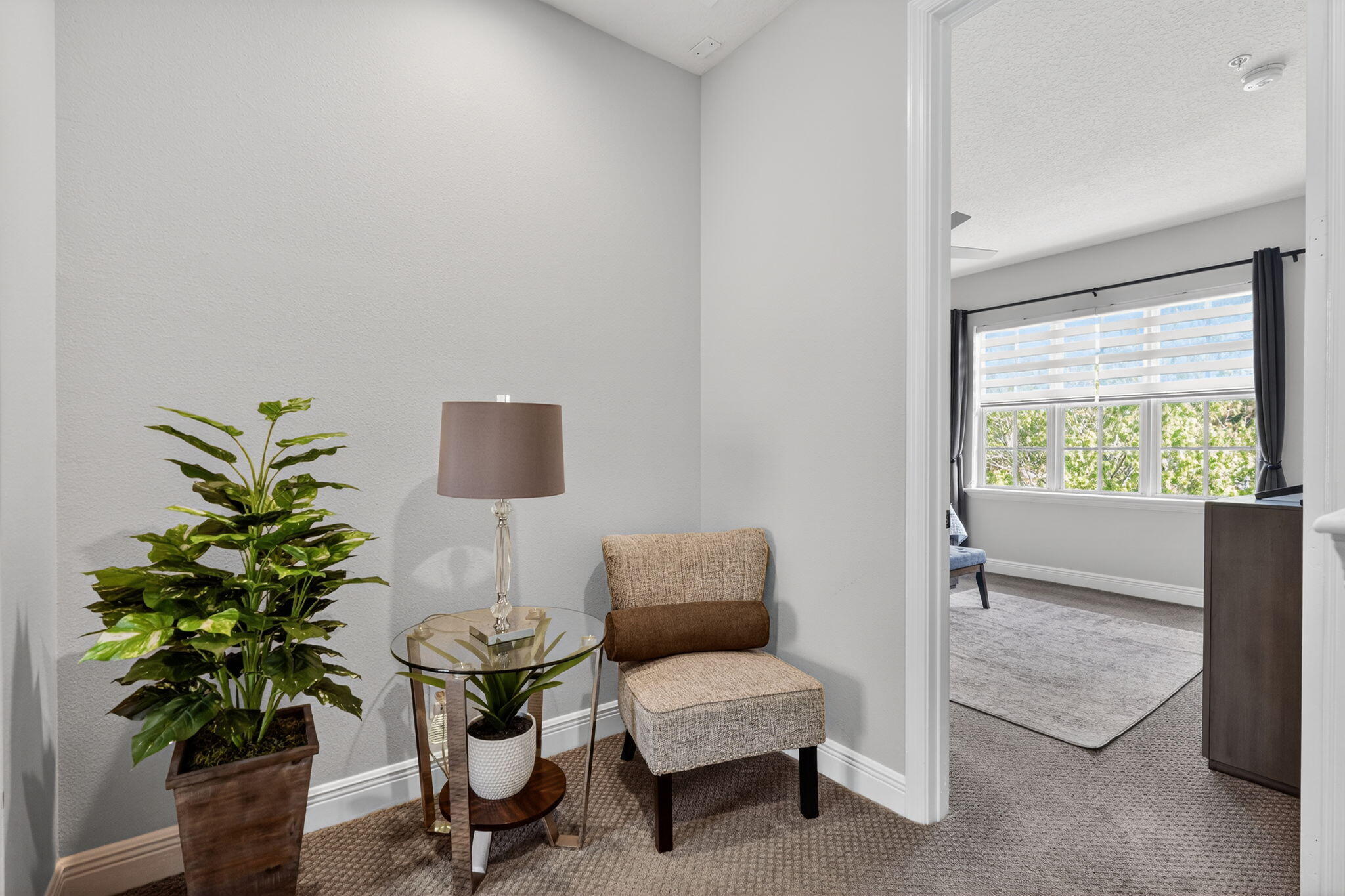 108 Morning Dew Circle Jupiter, FL 33458 - Photo 20 of 46 a living room with furniture and a potted plant