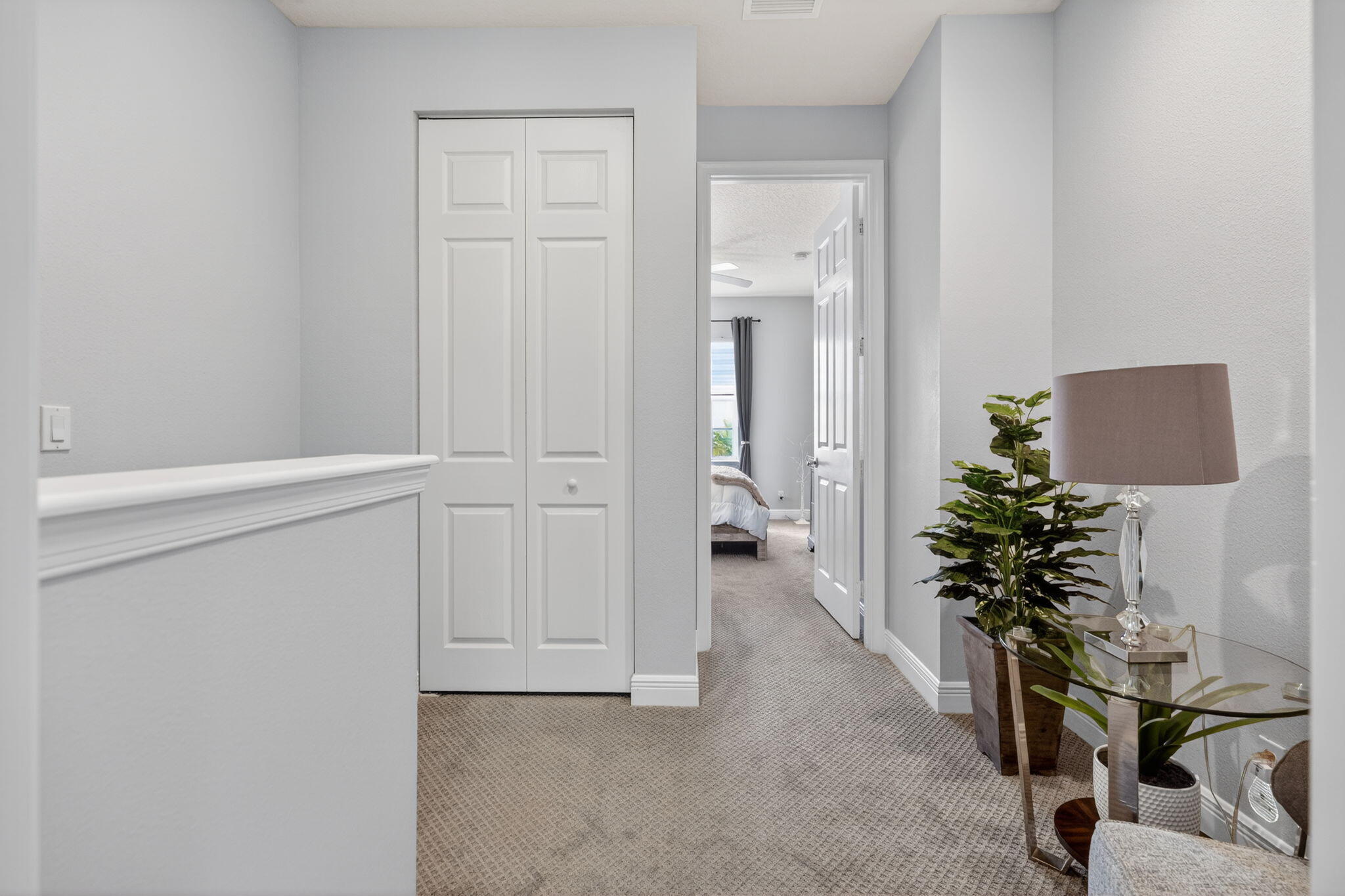 108 Morning Dew Circle Jupiter, FL 33458 - Photo 21 of 46 view of hall way with furniture and a potted plant