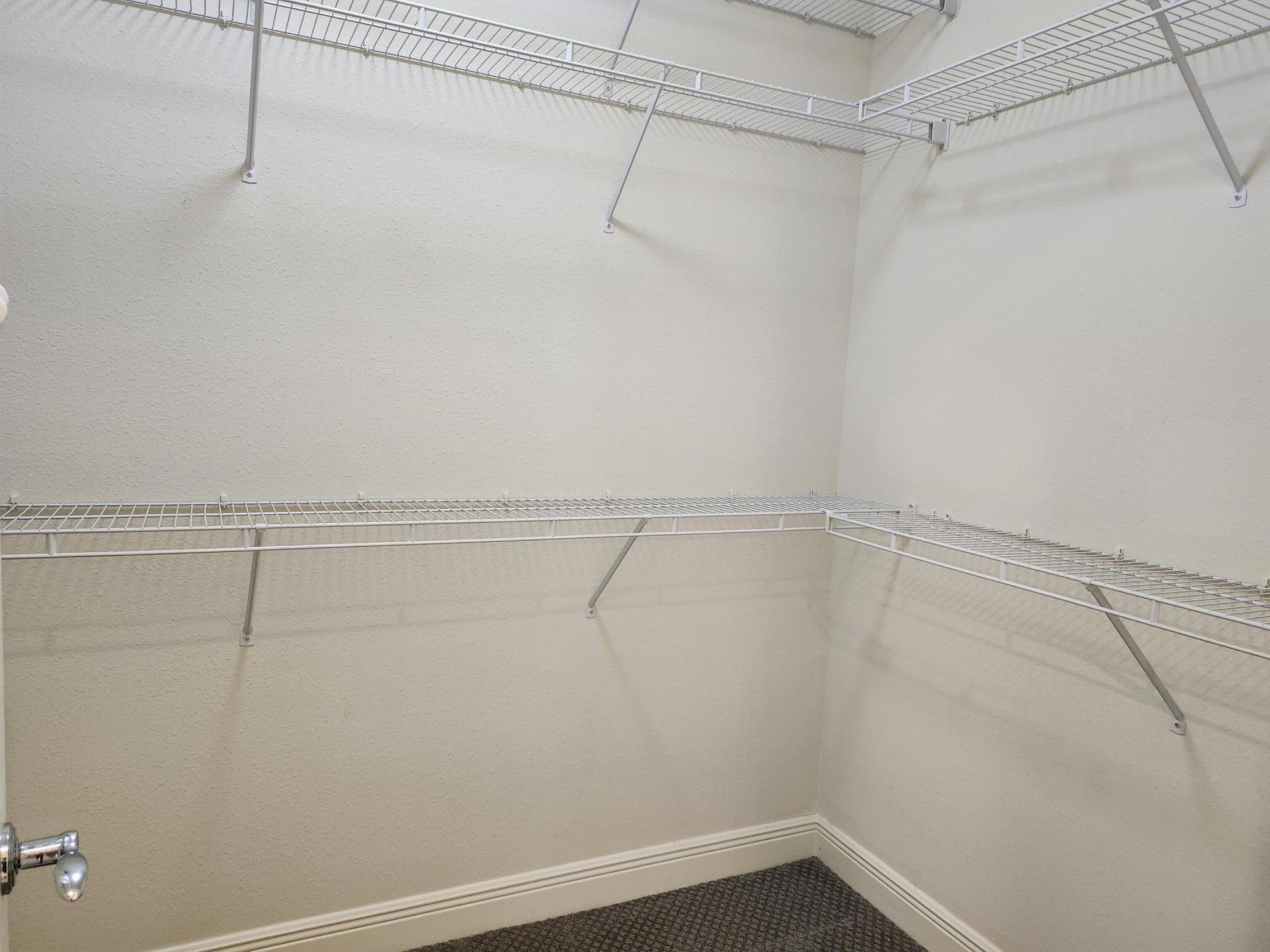 108 Morning Dew Circle Jupiter, FL 33458 - Photo 27 of 46 a view of a room with racks on the wall